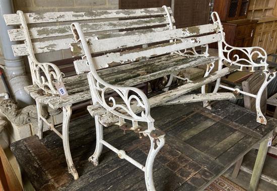 A pair of Victorian style slatted aluminium garden benches (in need of repair), width 122cm